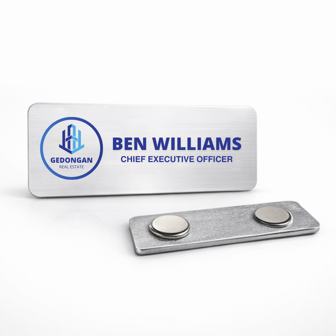Custom aluminum name badge displayed on office desk, highlighting professional branding and personalized design