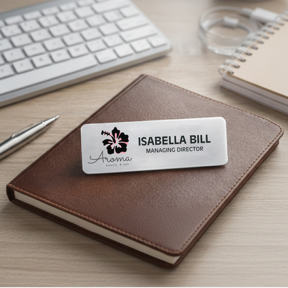 Personalized aluminum name badge displaying a company logo and employee title, perfect for business meetings and corporate events