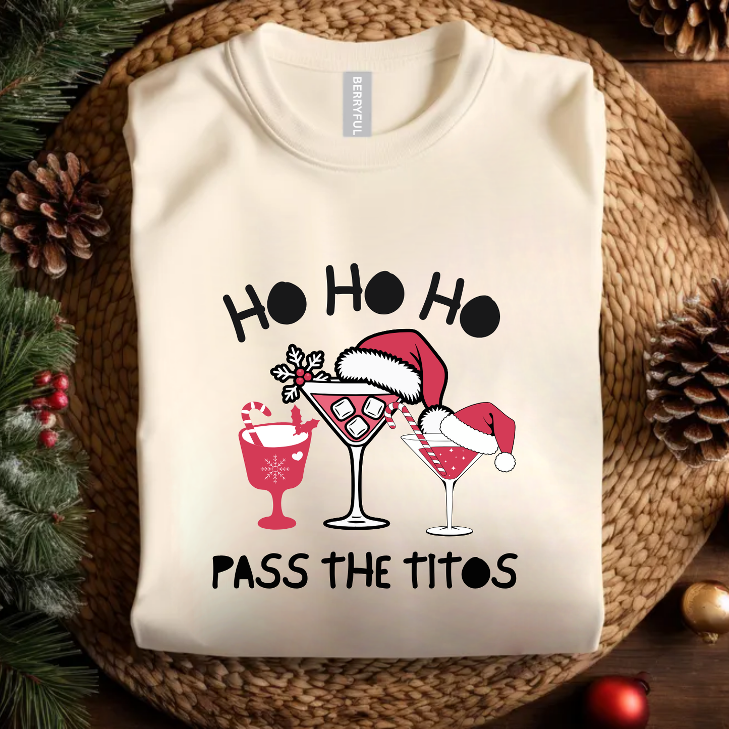 Beige sweatshirt with Christmas-themed design featuring cocktails and Santa hats on a woven surface. holiday funny t shirt