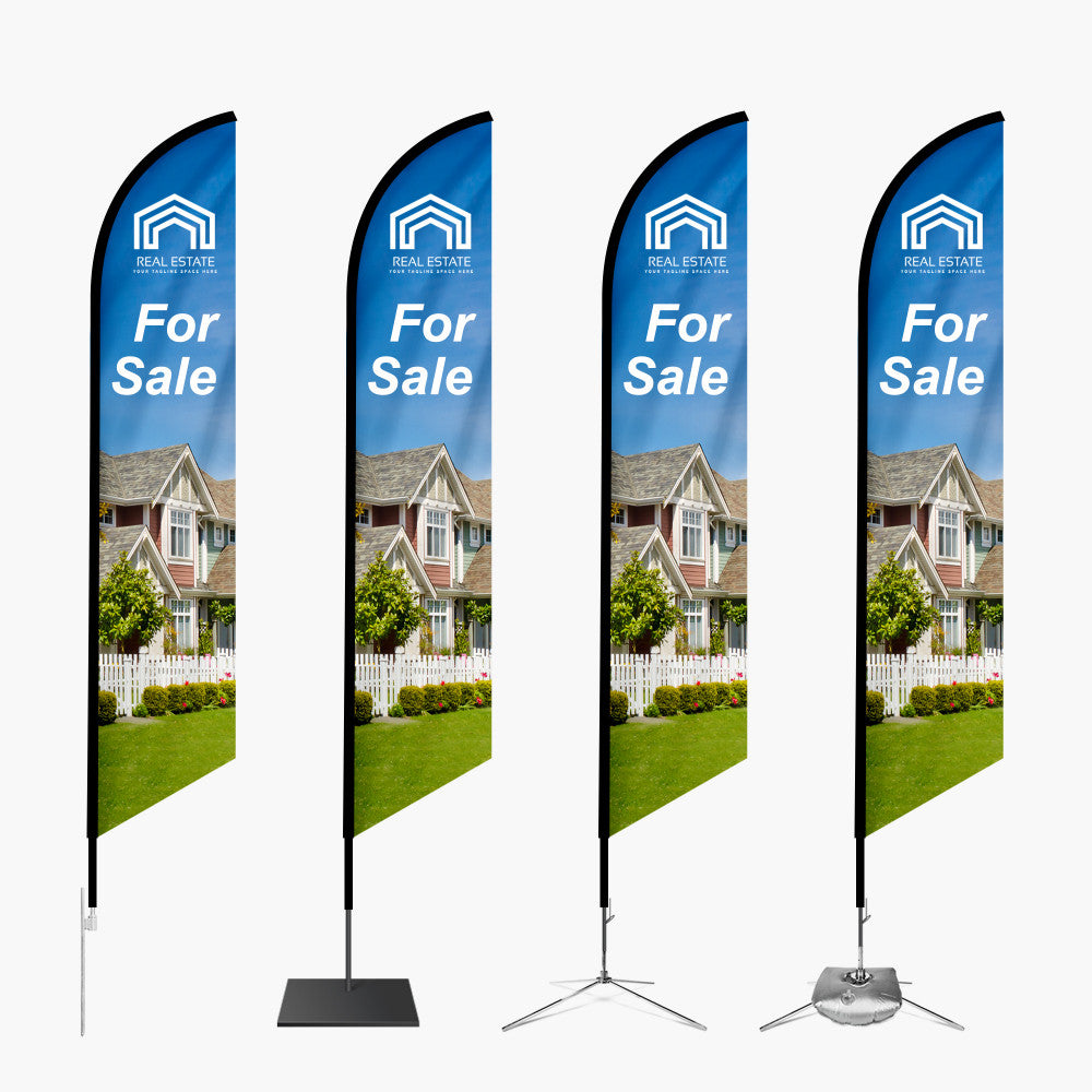 Four 'For Sale' real estate flags with a house image on a white background