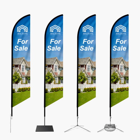 Four 'For Sale' real estate flags with a house image on a white background
